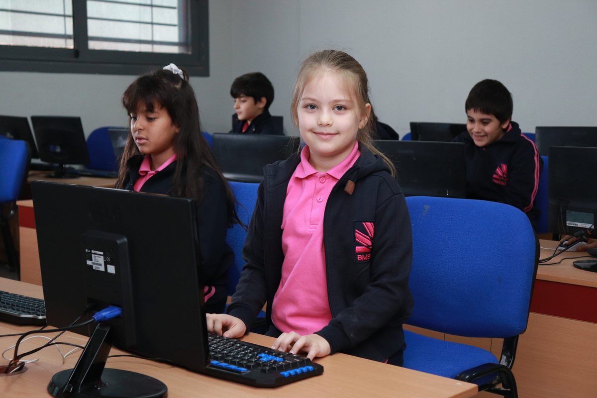 Students learning in the school computer lab