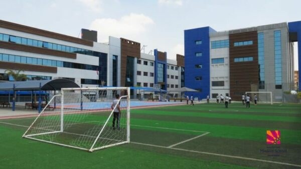 Students using the football field at the IMSSG campus