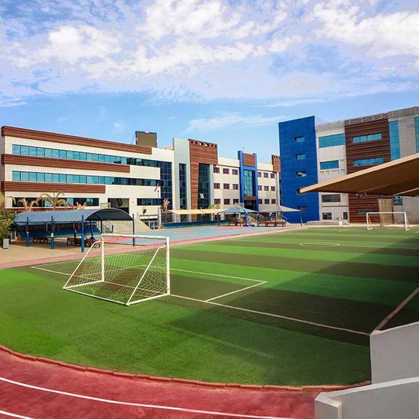 IMSSG school building overlooking the outdoor sports field